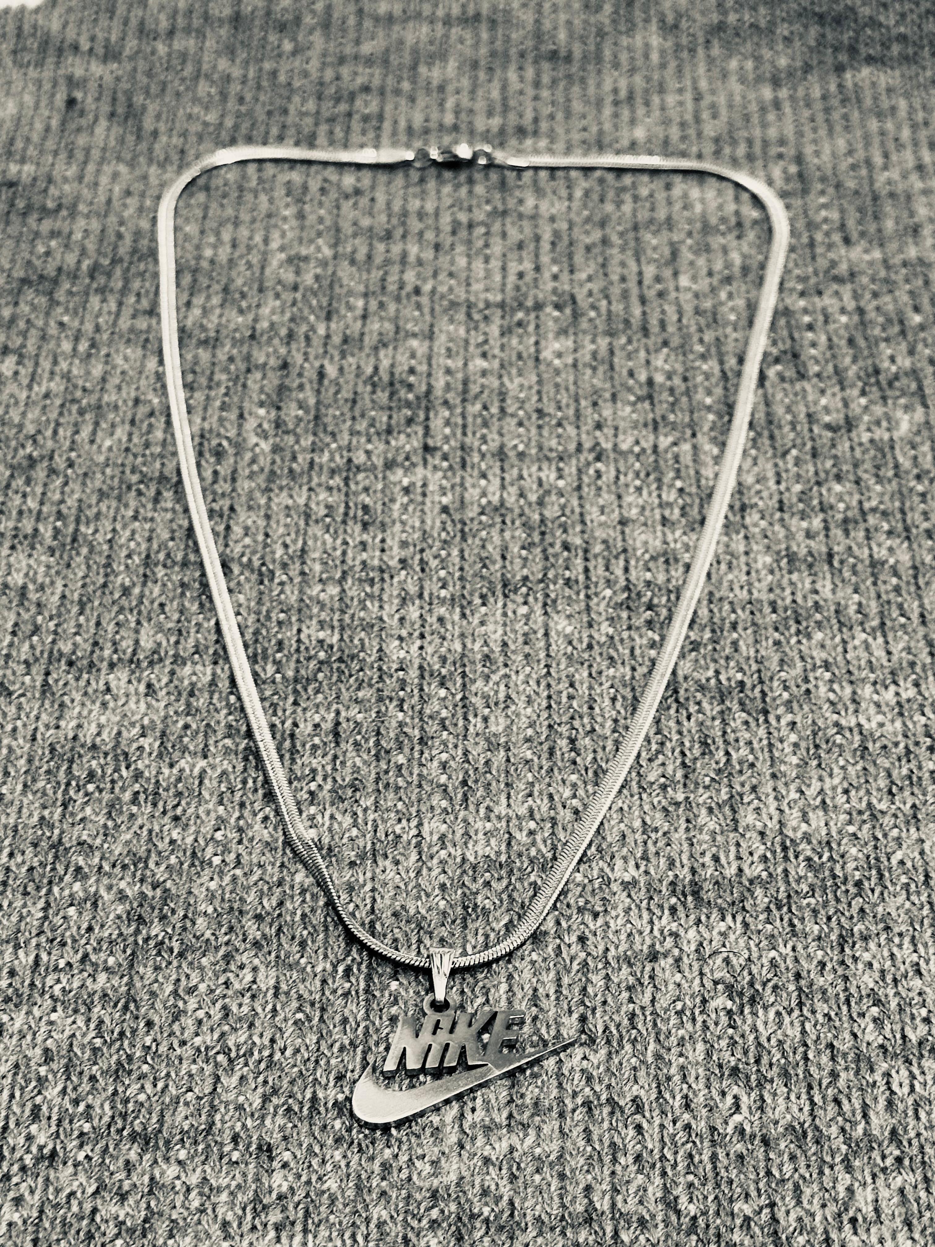 A) Nike Necklace Stainless Steel